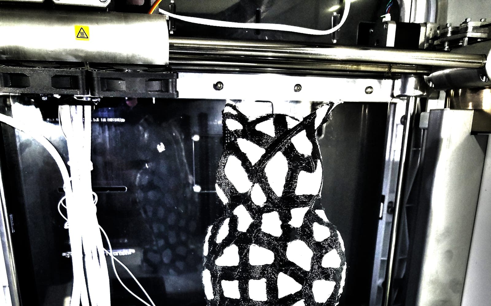 Black and white lattice owl display model on a printer bed