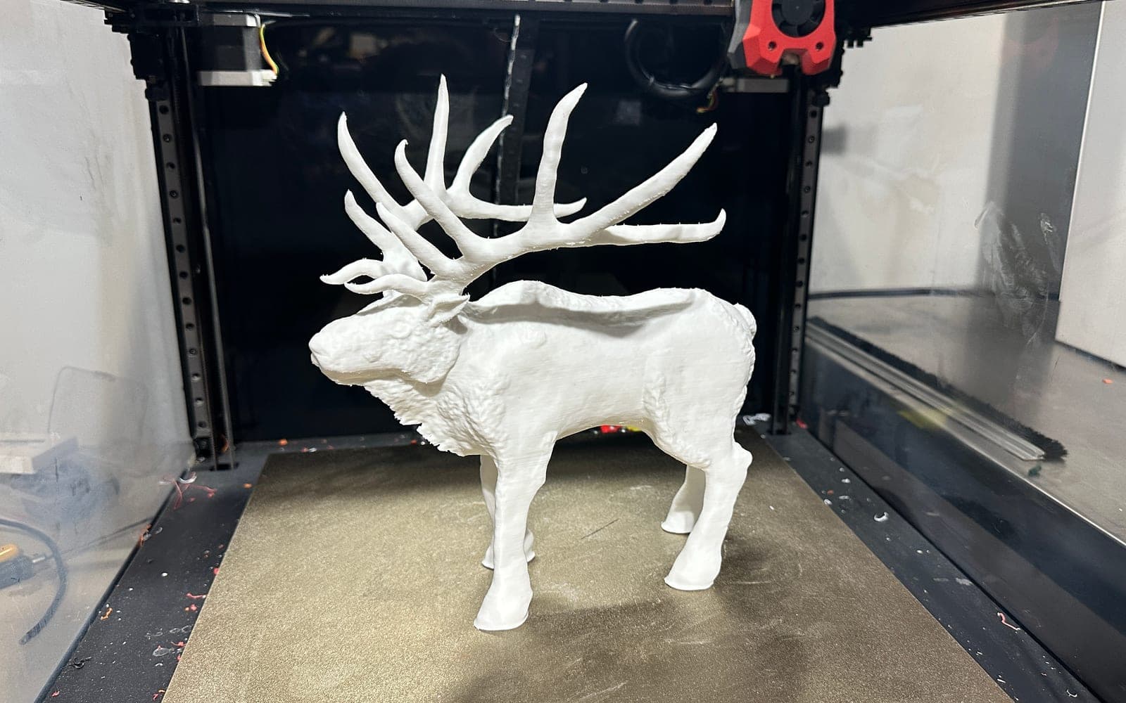 Large white display animal model printed on a 3D printer bed